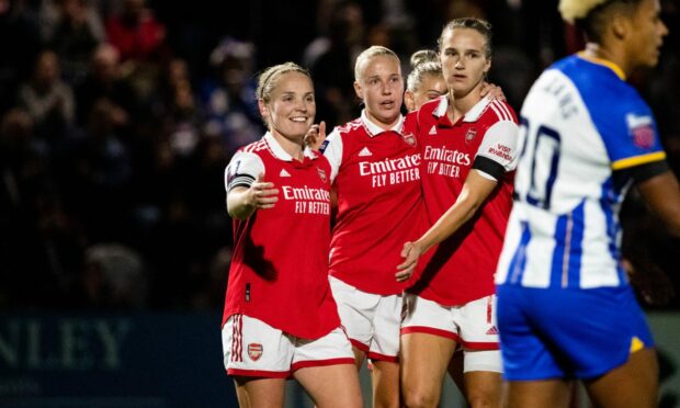 From L-R: Arsenal's Kim Little, Beth Mead and Vivianne Miedema celebrate the opening goal against Brighton in WSL. (Photo by Liam Asman/SPP/Shutterstock)