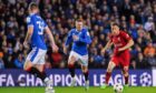 Diogo Jota of Liverpool takes on John Lundstram and Leon King of Rangers in the Champions League on Wednesday.