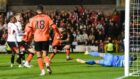 Dundee United's Aziz Behich makes it 1-0 against Aberdeen at Tannadice.