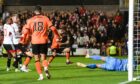 Dundee United's Aziz Behich makes it 1-0 against Aberdeen at Tannadice.