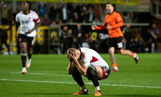 Aberdeen's Ross McCrorie looks dejected after scoring an own goal to make it 4-0 Dundee United.