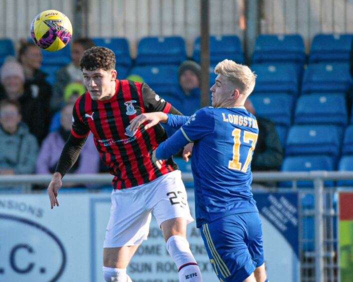 Caley Thistle defender Zak Delaney beats Luis Longstaff to the ball. Image: SNS