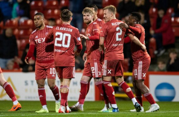 The Aberdeen players celebrate Kevin Holt's own goal making it 2-0. Image: SNS Group