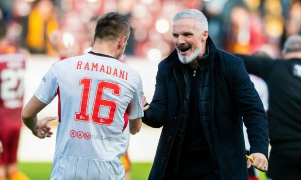 Aberdeen manager Jim Goodwin with Ylber Ramadani at full-time at Fir Park. Image: SNS.
