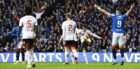 The ball hits Aberdeen's Jayden Richardson (centre) on the hand at Ibrox. Image: Rob Casey/SNS