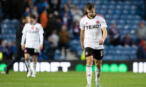 Ylber Ramadani was a dejected figure at full-time at Ibrox. Image: SNS Group