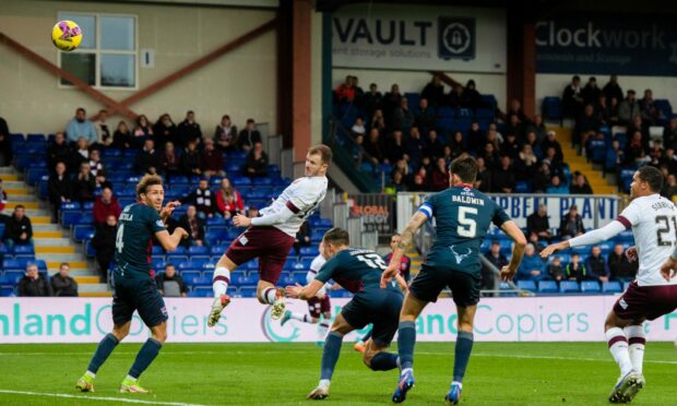 Hearts' Andy Halliday heads his side 2-1 in front at Ross County.  Images: Mark Scates SNS Group