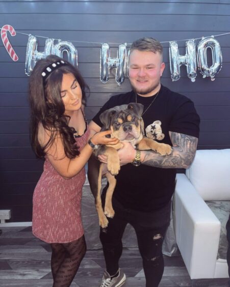 Bradley Smith with his partner Sinead Reid and their dog.