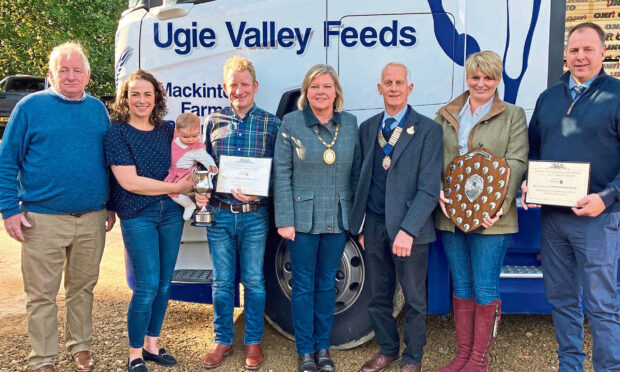 Winners, from left, Jim Mackintosh, Helen Mackintosh with daughter Alice, and Fraser Mackintosh, Aberdeenshire provost Judy Whyte, RNAS president Billy Stewart, and runners-up Fiona and Stewart Stronach.