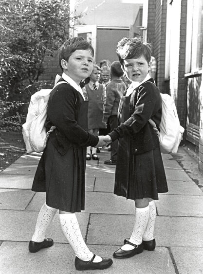 Two school pupils on their first day of primary school