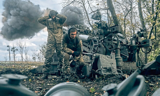 Russia's invasion of Ukraine has sent shock waves through natural gas, coal and electricity as well as oil markets, stoked inflation and created a looming risk of recession and food insecurity. Picture shows Ukrainian soldiers firing at Russian positions  in Ukraine's eastern Donetsk region. Image: AP Photo/LIBKOS