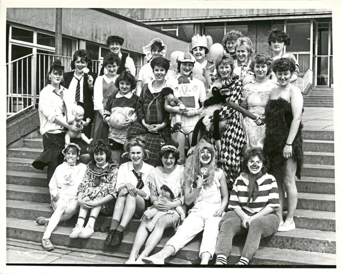 A large group of nurses dressed up for charity