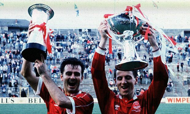 Charlie Nicholas and Paul Mason celebrate after beating Rangers in the 1989 League Cup Final.