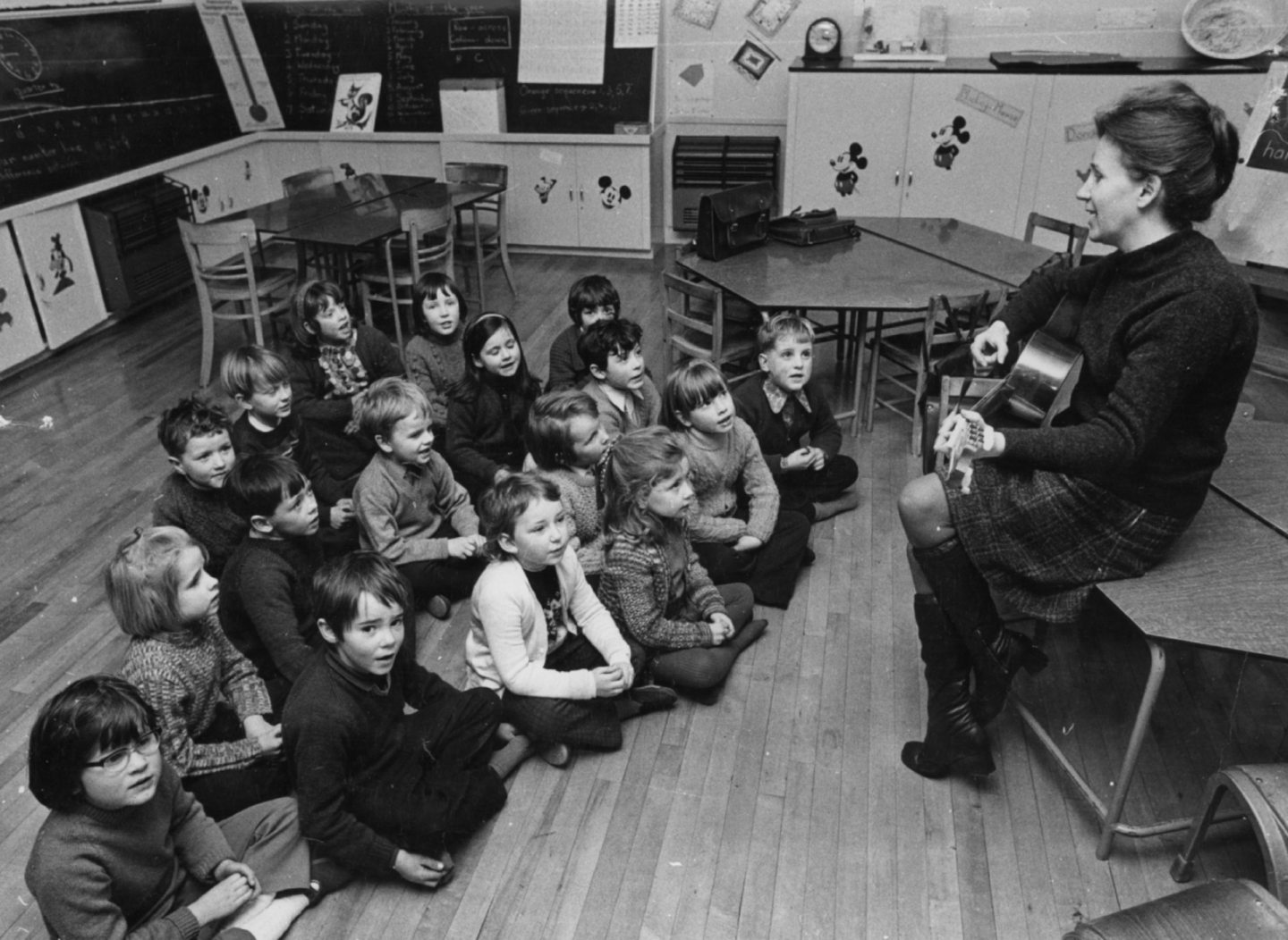 Lorna plays the guitar to the infant class at Strathdon School in 1970. Image: Lorna Alexander