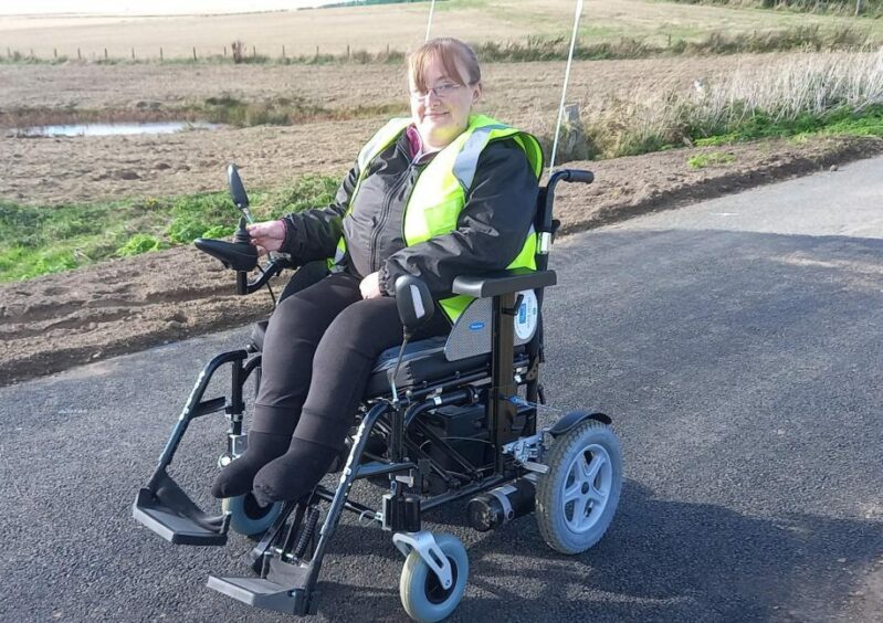 Jacqueline Fraser pictured at the recently reopened Bruntyards bridge in King Edward. It was washed away during heavy rain in September 2019. Image: Kirstie Topp/DC Thomson