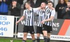 Fraserburgh's Scott Barbour, left, and Paul Campbell, right, celebrate with Connor Wood, centre, who scored the second goal in their Scottish Cup win against Stranraer