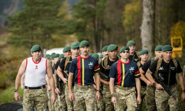Lance Corporal Luke Granger carrying out the final march alongside fellow commandos. Image: Iain Ferguson.