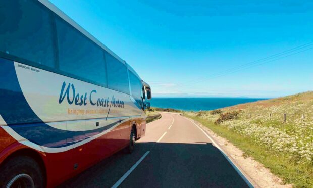 West Coast Motors bus heads to scenic coastal destinations in Scotland