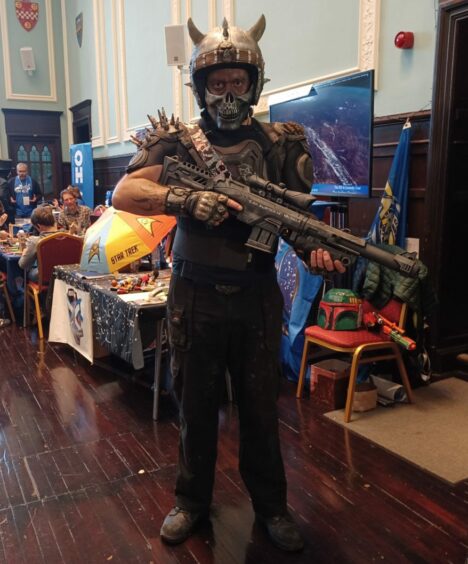 A man dressed as a Mad Max character.
