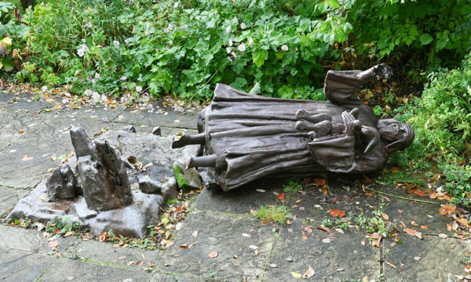 Statue broken in half at Elgin Biblical Garden