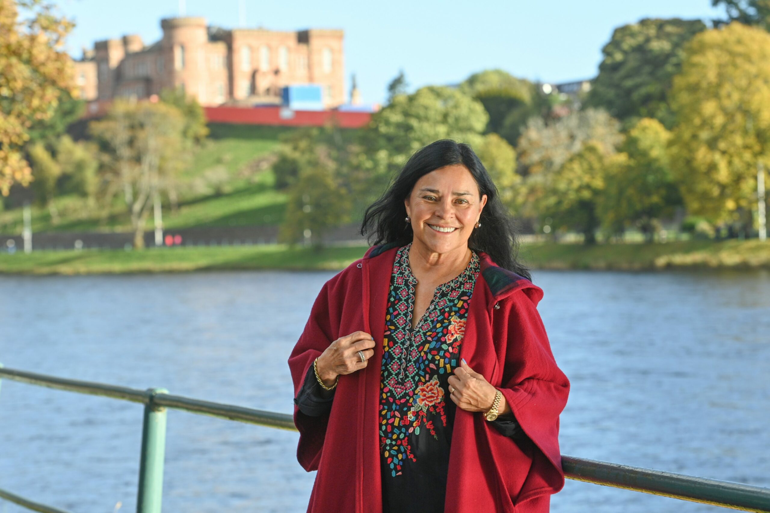 Outlander author Diana Gabaldon standing next to River Ness