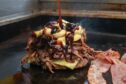 A burger being prepared at The Big Orange food truck. Image: Jason Hedges/DC Thomson