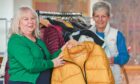 Jackie Andrews  and Anne Sim have set up the Elgin Coat Hangar to help those who need a coat or jacket this winter. Picture: Jason Hedges/DC Thomson