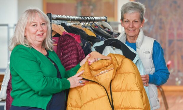 Jackie Andrews  and Anne Sim have set up the Elgin Coat Hangar to help those who need a coat or jacket this winter. Picture: Jason Hedges/DC Thomson