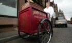 Bridie baker Bill McLaren, who has died aged 82, with a restored 1929 delivery tricycle.