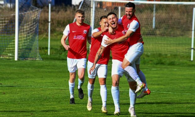 Callum Dunbar celebrates after scoring for Culter against East End. Image: Kenny Elrick    / DC Thomson