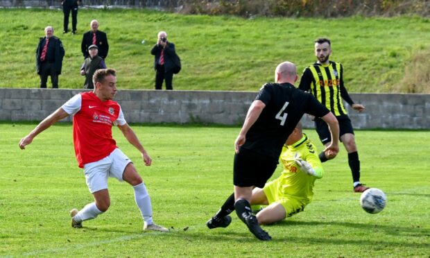 William Mathers scoring for Culter against East End. Image: Kenny Elrick/ DC Thomson.