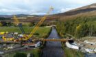 Drone images of beams being positioned on the new Gairnshiel Bridge