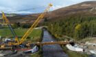 A multi-million pound project has been going on for months to build a new, modern bridge at Gairnshiel to replace the crumbling 18th century one further up river. But the opening date has been delayed. 
Image: Kenny Elrick/DC Thomson