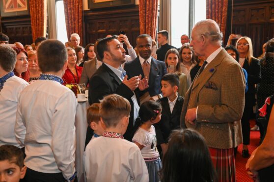 The King met families settled in Aberdeen from Afghanistan, Syria and Ukraine. Picture by Kenny Elrick.