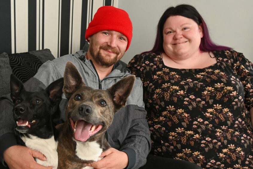 Claire and Ricki Inkson with dogs Scully and Boulder who were rescued from Moray puppy farm