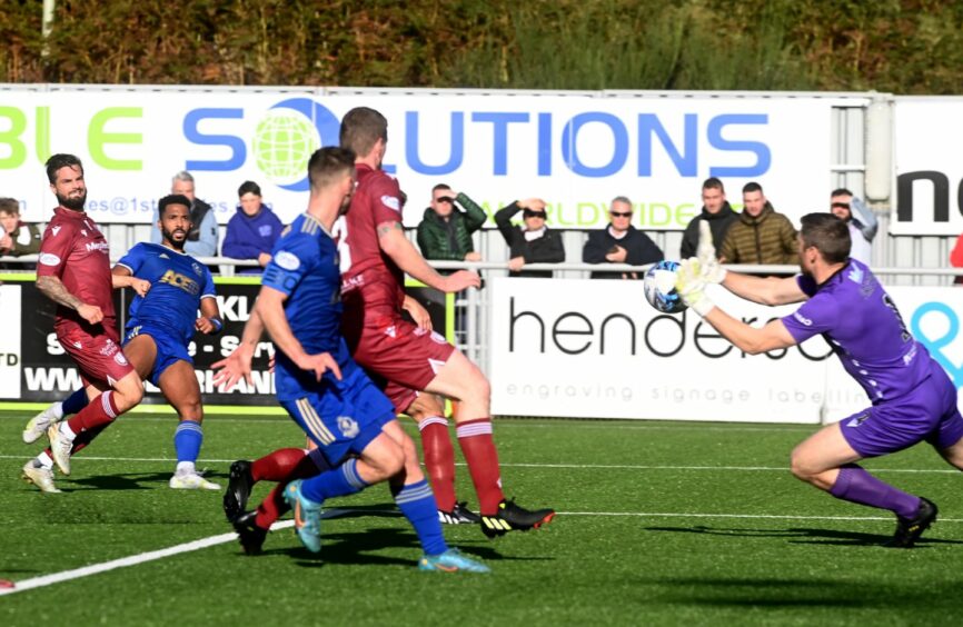 Shay Logan's effort on goal leads to Connor Scully's second Cove Rangers goal against Arbroath. Image: Kenny Elrick/DC Thomson