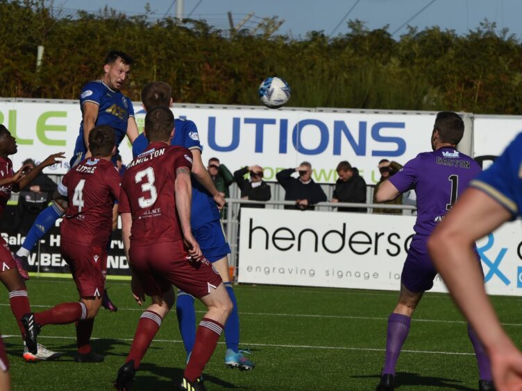 Connor Scully heads in Max Johnston's cross to give Cove Rangers the lead against Arbroath. Image: Kenny Elrick/DC Thomson