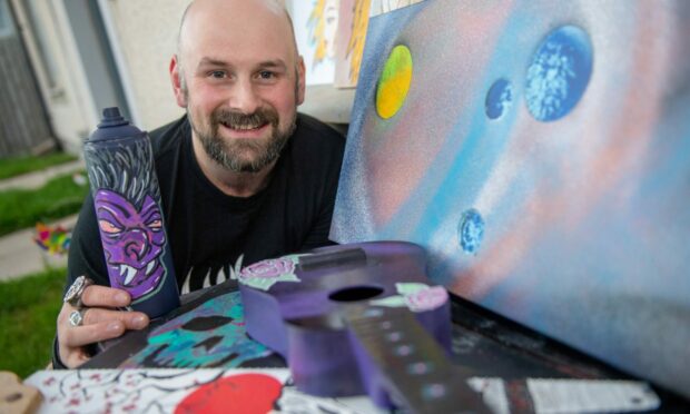 Graffiti artist Lee Carnegie aka Lac and his artwork. Picture by Kath Flannery / DC Thomson.
