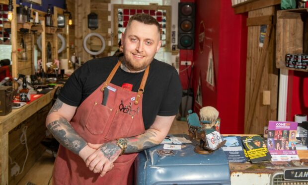 The north-east's kindest barber? Marcin Masny of Cushty Cut Barber in Inverurie may just be. Picture by Kami Thomson / DC Thomson