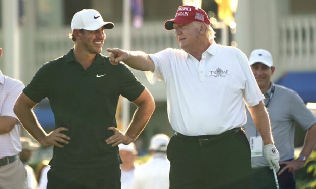 Turnberry owner Donald Trump with Brooks Koepka in the ProAm of the LIV Golf Team Championship.
