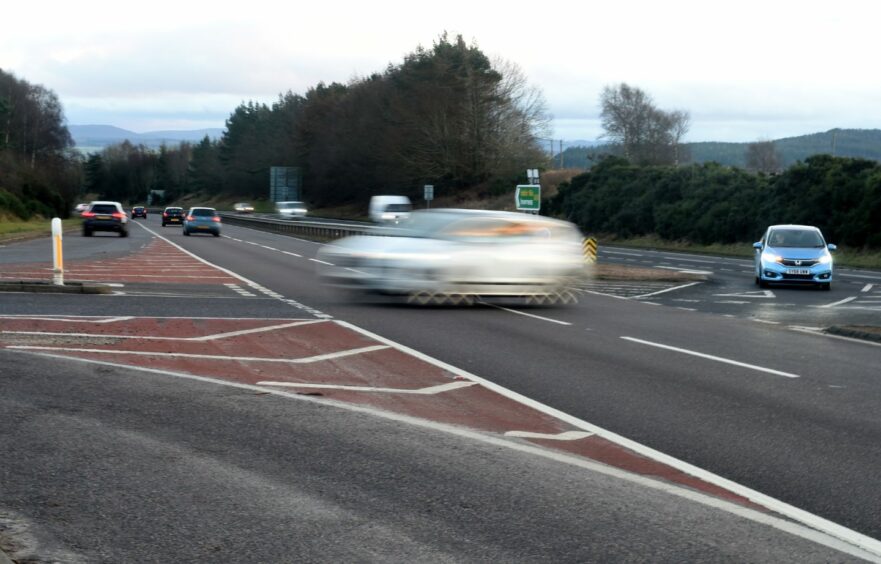 A car turning at the Munlochy junction 