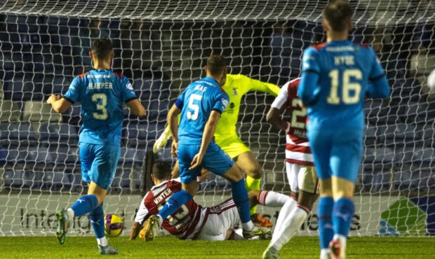 Andy Winter slides in to score the winner for Hamilton at Inverness. Images: SNS Group