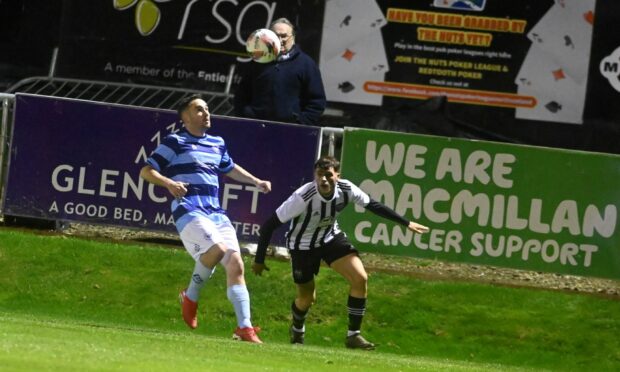 Alasdair Stark of Banks o' Dee, left, and Fraserburgh's Ryan Sargent battle for possession during the Aberdeenshire Shield tie at Bellslea