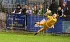 Banks o' Dee goalkeeper Ross Salmon saves from Fraserburgh's Scott Barbour during the penalty shoot-out between the sides but the goalkeeper was deemed to be off his line and a retake was ordered