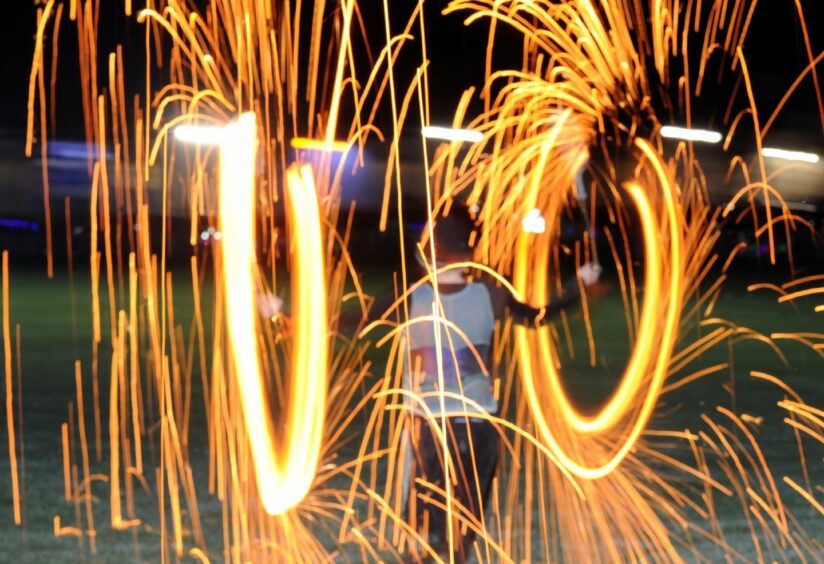 sparklers being used as entertainment at a display in Inverness, 2011