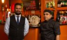 Spice Tandoori restaurant with staff standing by the bar
