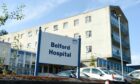 The outside of the current Belford Hospital in Fort William. A large sign that reads Belford Hospital.
