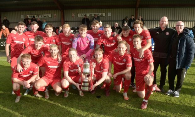 The victorious Brora Rangers squad with the North of Scotland Cup after their win against Clachnacuddin