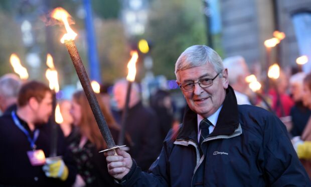 Allan Campbell, president of An Comunn Gaidhealach - pictured at the Mod's torchlight procession, said the Mod in Perth has been a huge success. Image: Sandy McCook/ DC Thomson.