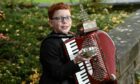 10-year-old Alistair was crowned the winner of the under 13's Accordion competition at Perth's AK Bell Library. Image: Sandy McCook/ DC Thomson.